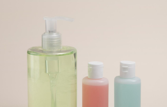 Three bottles of personal care products containing a rheology modifier.